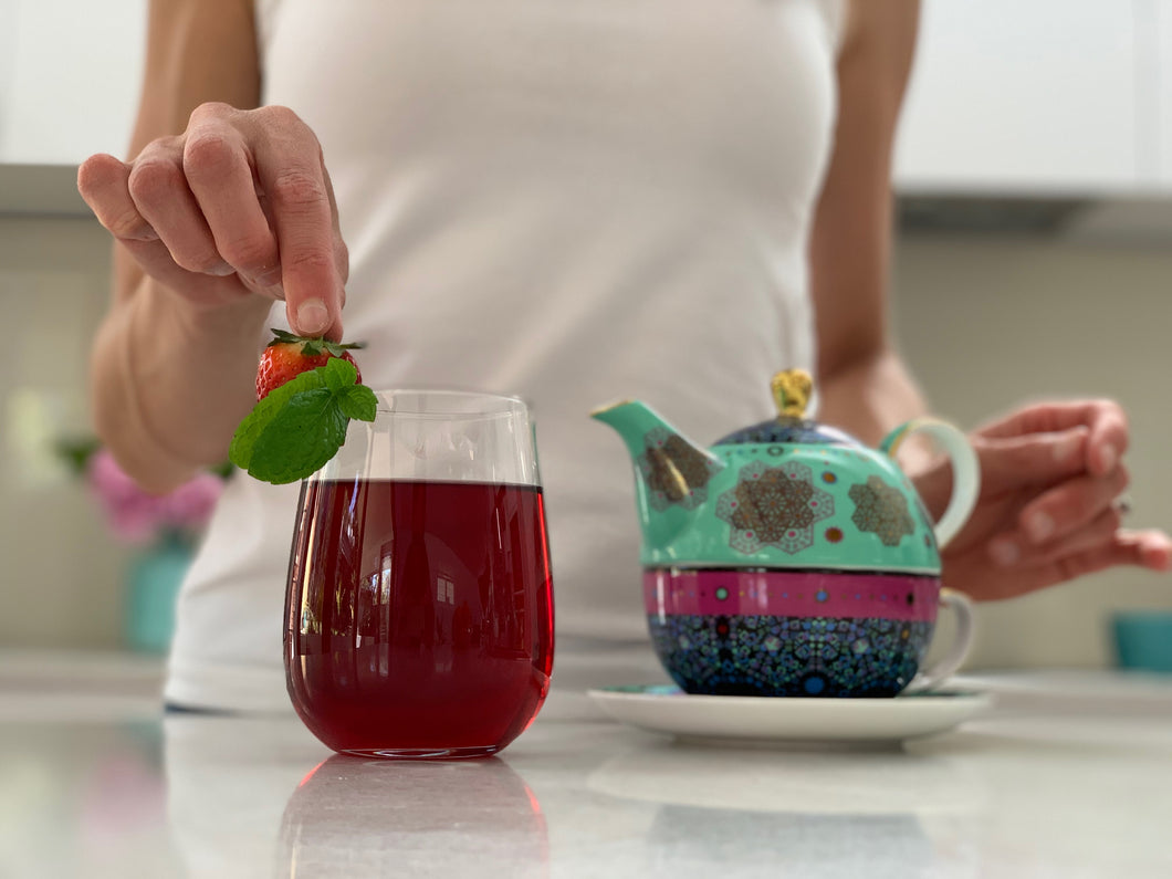 This is Skin Glow tea. Key flavours are Hibiscus, Spearmint, Fennel and Rose. It's delicious hot or sipped as an iced tea. Add some berries and fresh mint to add that wow factor!